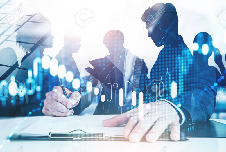 Silhouettes of business people with a financial chart overlay