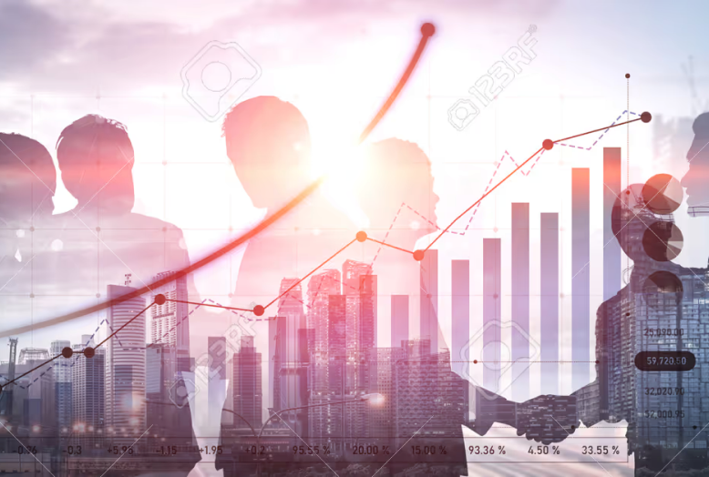 Silhouettes of business people with a rising stock chart overlay