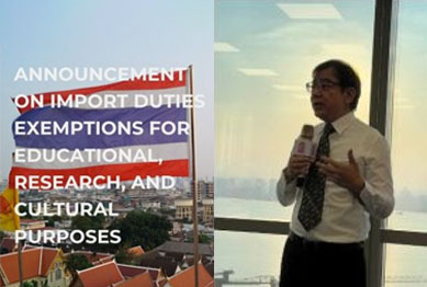 A speaker holding a microphone in front of a Thai flag and city skyline, overlaid with the seminar's import duty exemption announcement headline.